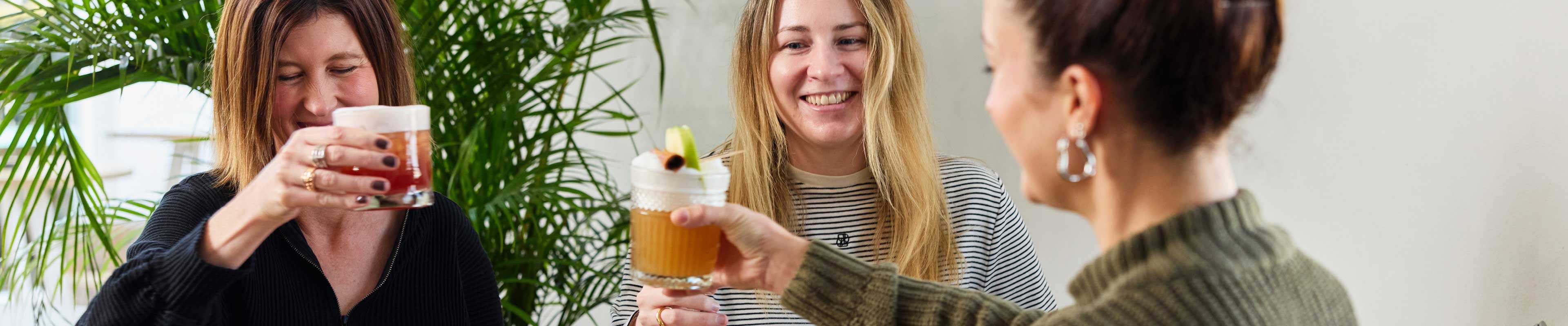a group of female friends enjoying drinks